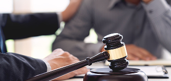 lawyer holding client shoulder