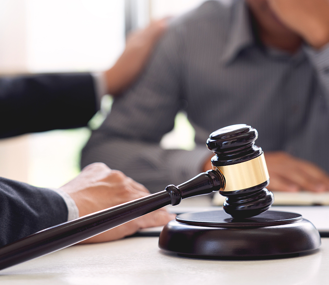 lawyer-holding-client-shoulder